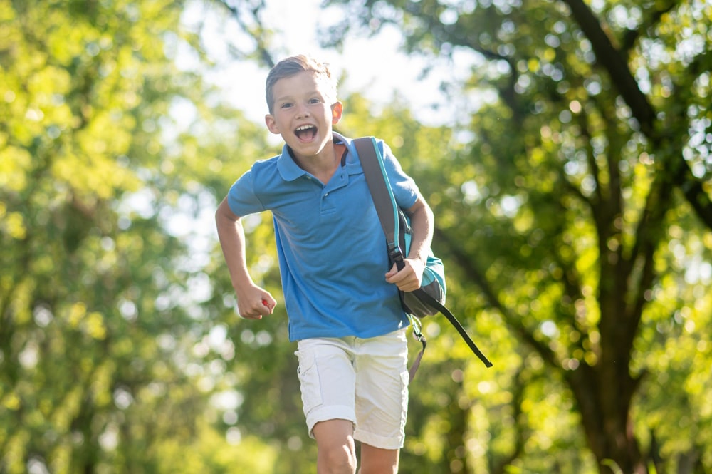 boy running happily after ocd therapy