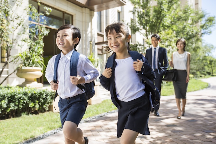 school refusal, two children walking in school uniform with backpacks