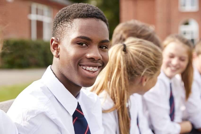 teen school boy smiling after youth counselling